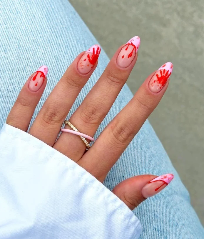 Dripping blood French tip Halloween nails with deep crimson red tips on a nude base.
