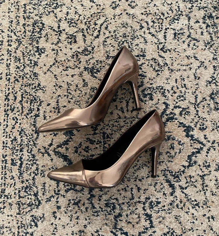 Bronze heels with a satin brown dress for a formal event
