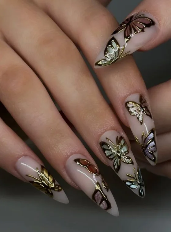 Butterfly accent acrylic nails featuring delicate butterfly nail art on pastel base.