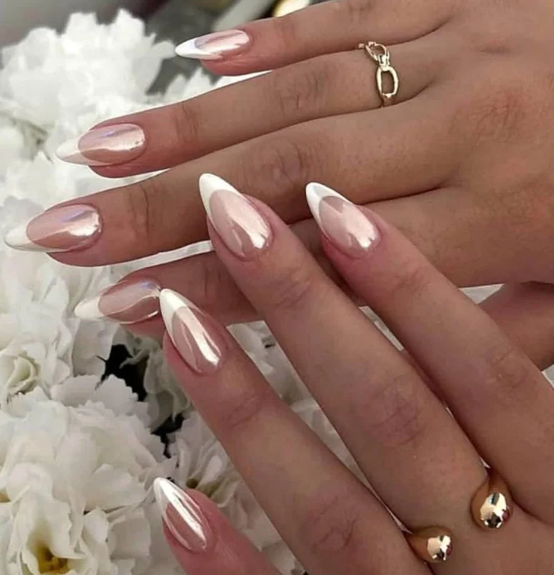 Chrome mirror acrylic nails with reflective silver metallic finish on long nails.
