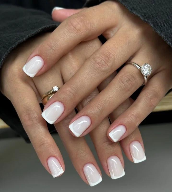 Clear glossy nails with an elegant purple dress