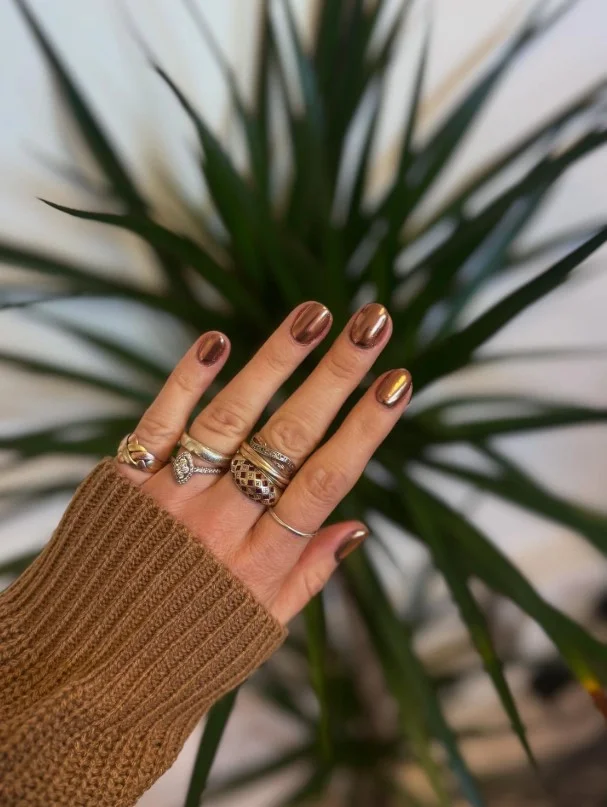 Copper chrome nails with reflective metallic autumn-inspired nail design.