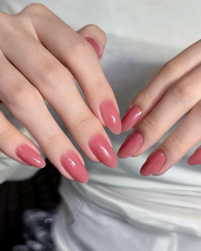 Dusty rose nail polish paired with a purple outfit