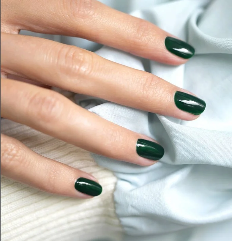 Emerald green manicure with a purple evening gown