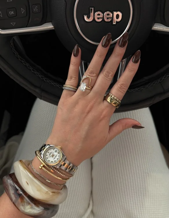 Espresso brown nails on fair skin with a rich elegant finish
