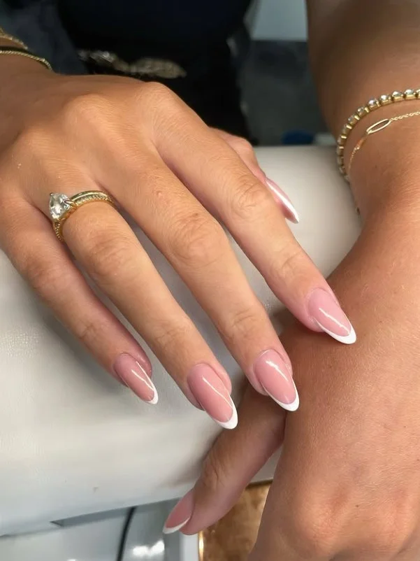 Classic French manicure with a stylish purple dress