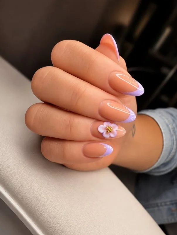 Lavender French tip nails with sheer pink base and elegant purple nail design.