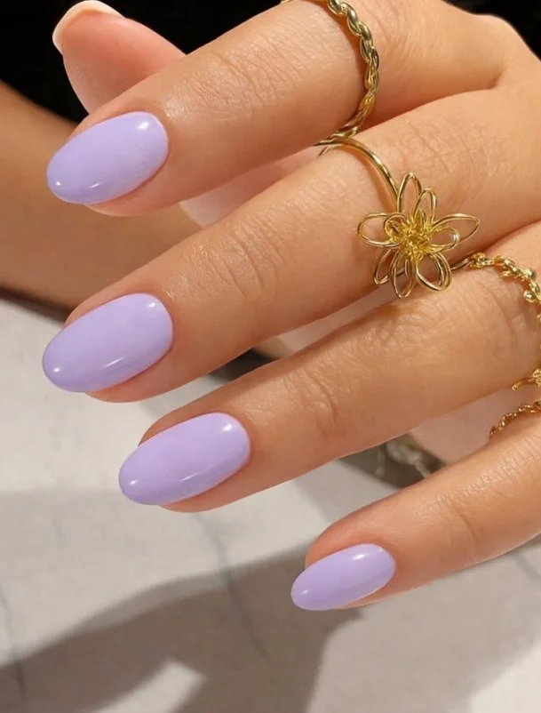 Soft lavender nails with a light purple dress