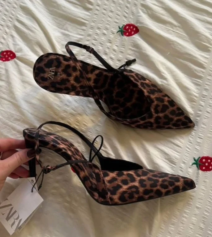 Leopard print heels paired with a green dress
