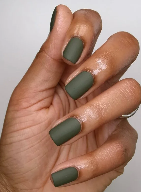 Matte olive green nails featuring smooth earthy fall nail color on almond nails.