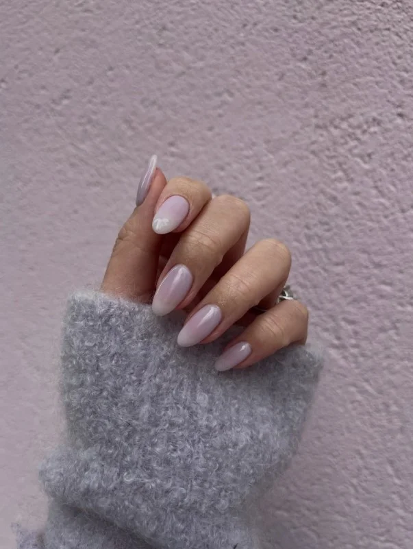 Milky lavender jelly nails with translucent glossy purple finish.