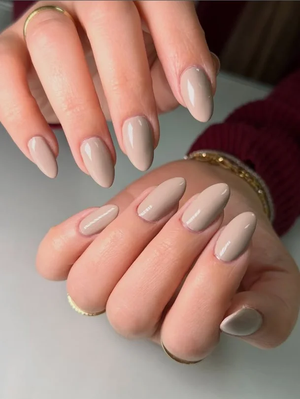Nude beige manicure on pale skin for a timeless everyday style