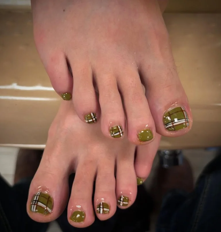Plaid accent toe nail design featuring burgundy, brown, and cream fall colors.