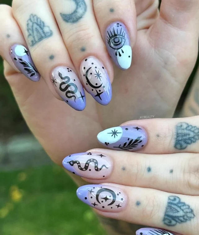 Purple witchy Halloween nails with silver stars and crescent moon details.