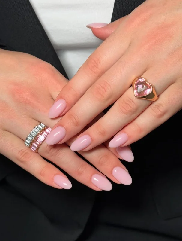 Sheer pink nails on fair skin with a clean natural look
