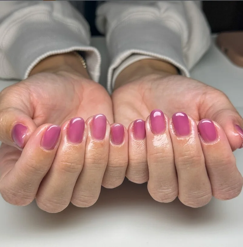 Short jelly nails with transparent glass-like glossy finish.