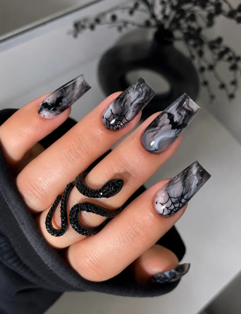 Smokey marble Halloween nails with black and gray swirling nail design.