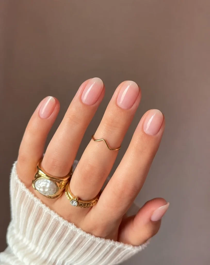 Soap nails short press-on manicure with a glossy milky nude finish on short rounded nails.