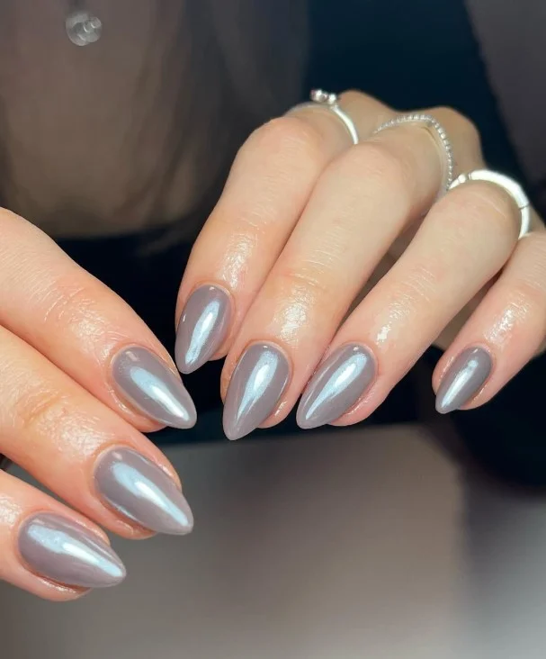 Soft gray nails on fair skin with a chic minimalist manicure