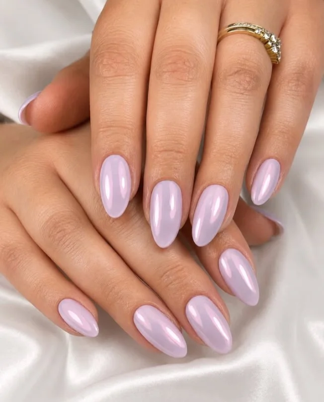 Soft lavender chrome nails featuring reflective metallic purple finish.