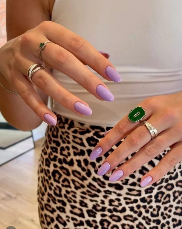 Soft lilac manicure with a purple spring dress