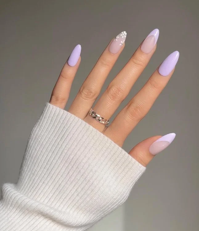 Soft lilac nails on pale skin with a delicate pastel manicure