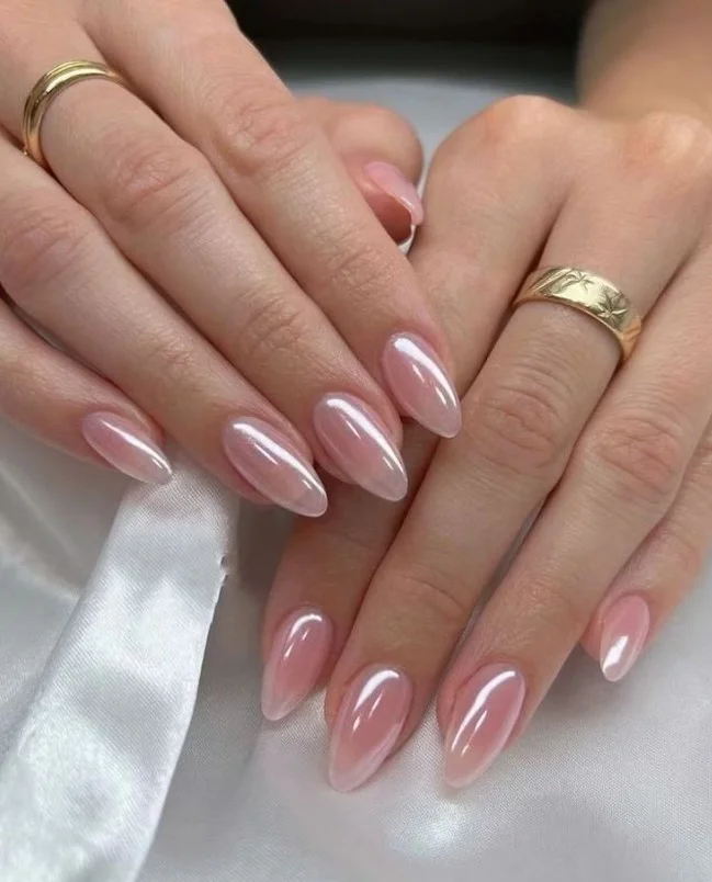 Strawberry milk acrylic nails with creamy soft pink glossy manicure.