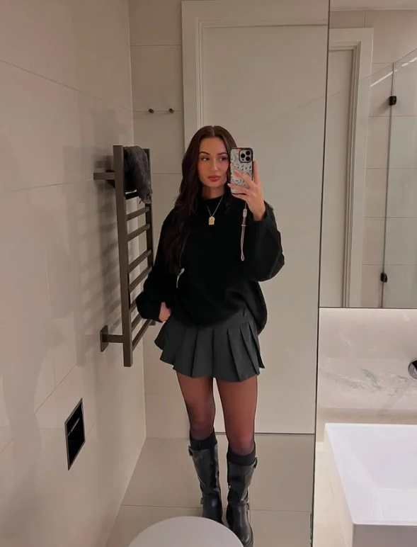 Mini skirt with tights oversized knit and black knee-high boots