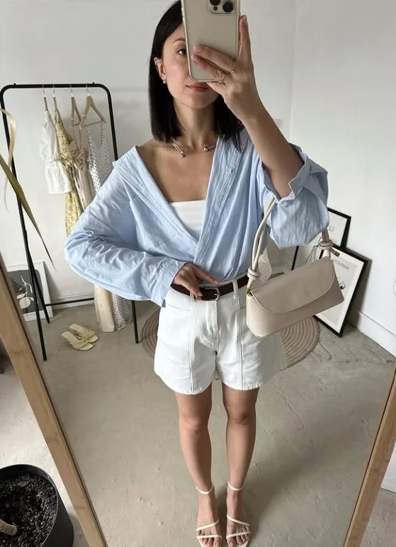 Blue button down shirt with white tailored shorts