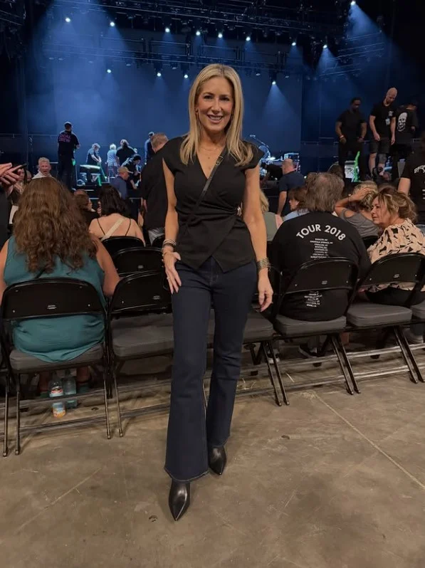 Bootcut jeans worn over pointed boots