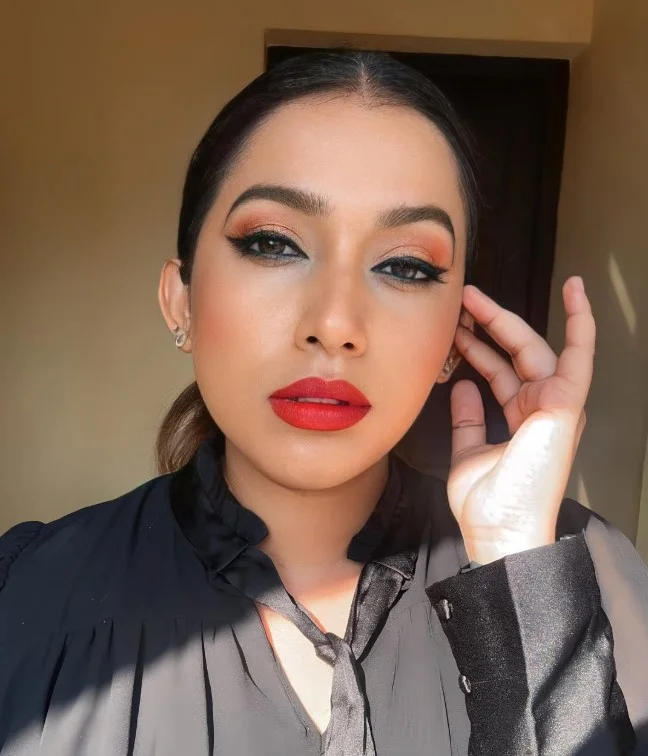 Cherry red lipstick creating a timeless glamorous evening look.