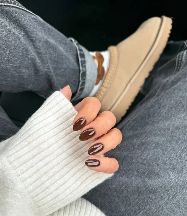 Rich chocolate brown manicure with high-shine top coat.