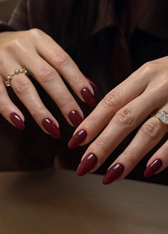 Classic cherry red nails with a glossy salon-quality finish.