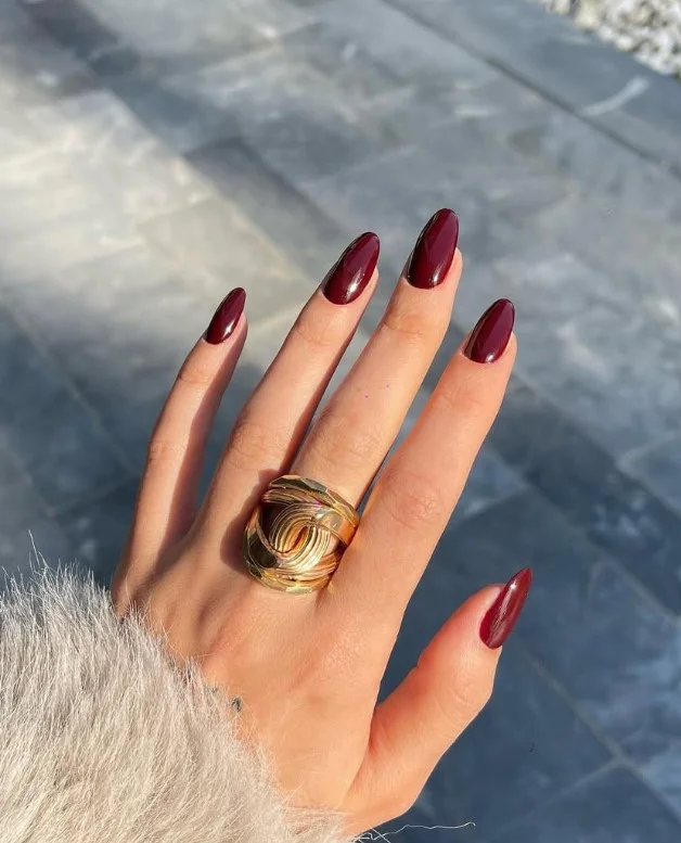 Deep burgundy nail varnish for elegant evening manicures.
