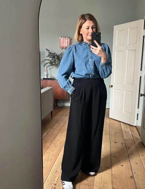 Denim button down shirt with black trousers for a polished outfit