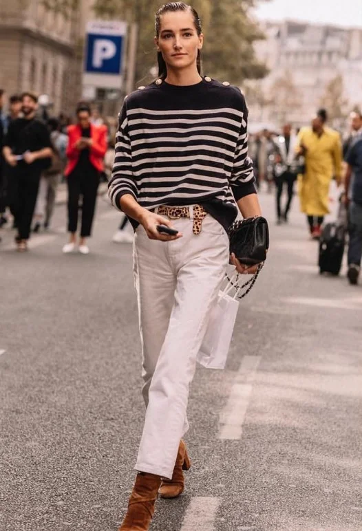 Ecru jeans with tan suede boots and a camel sweater