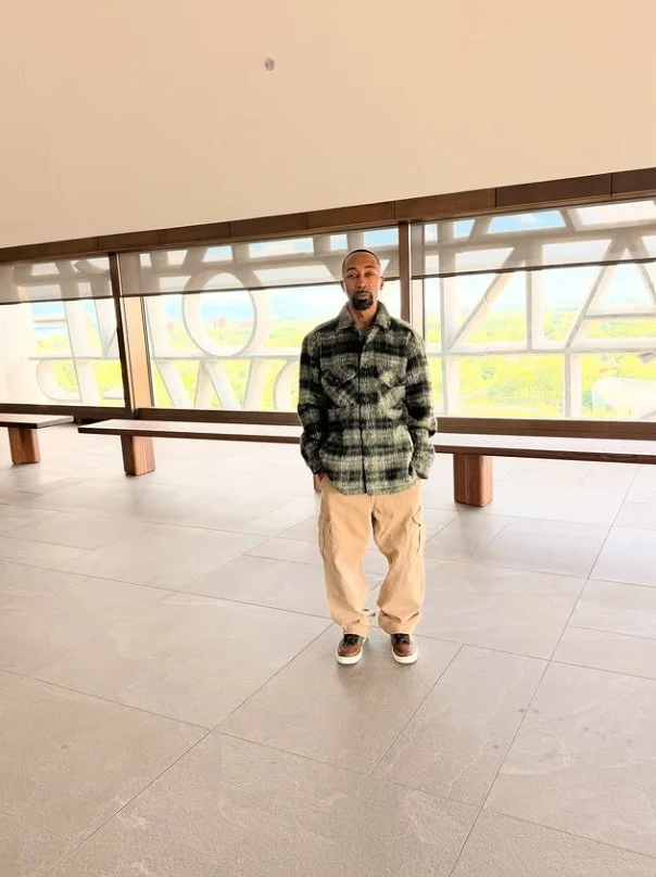 Green flannel shirt with beige chinos and brown suede shoes