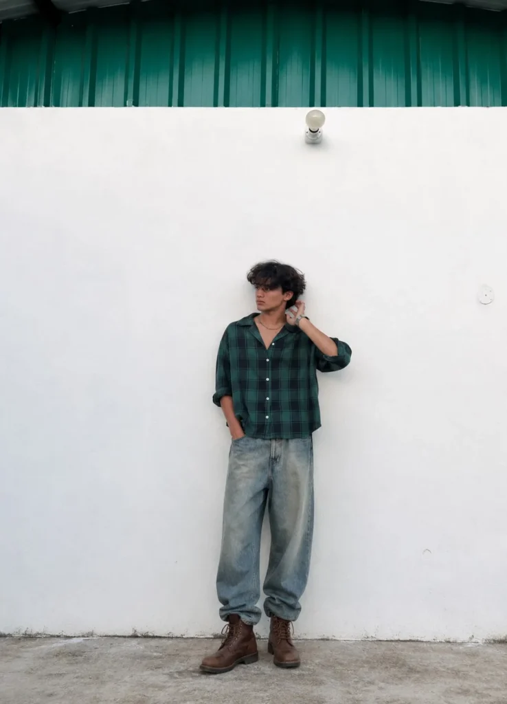 Green flannel outfit with dark jeans and rugged brown boots