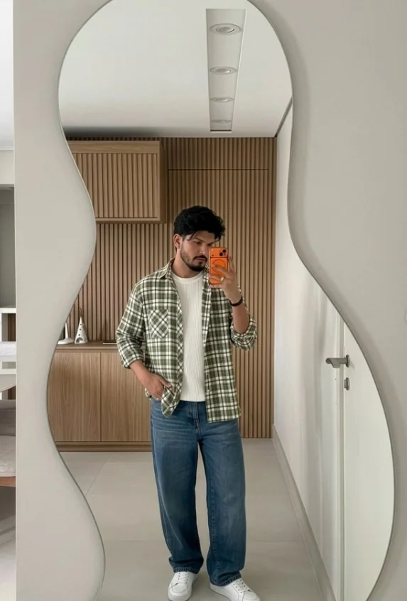 Green flannel shirt with dark denim and brown boots for men
