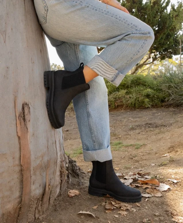 Light-wash jeans styled with chunky Chelsea boots