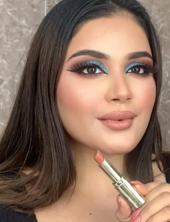 Peachy nude lipstick complementing warm fair skin undertones.