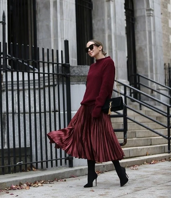Pleated midi skirt with tall boots and sweater