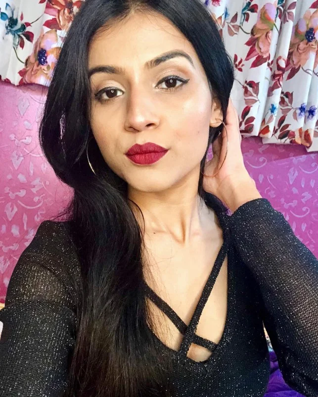 Plum lipstick for elegant evening makeup on fair skin.
