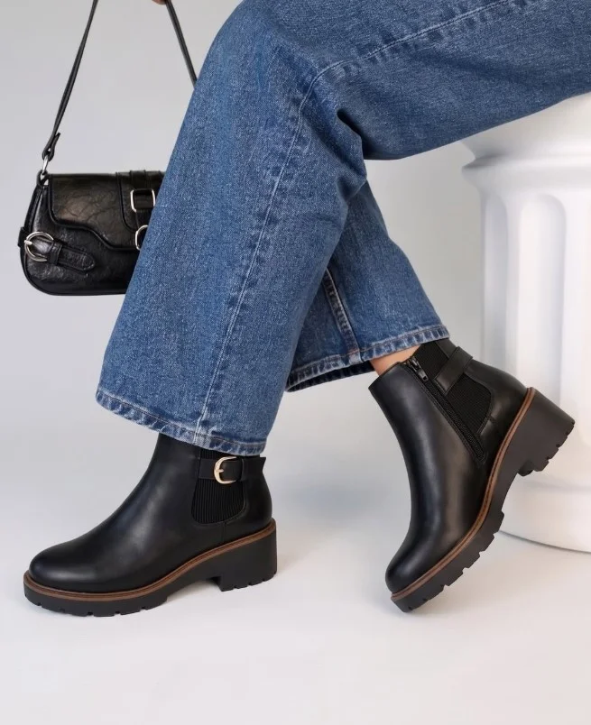 Relaxed jeans with lug-sole boots and a long fall coat