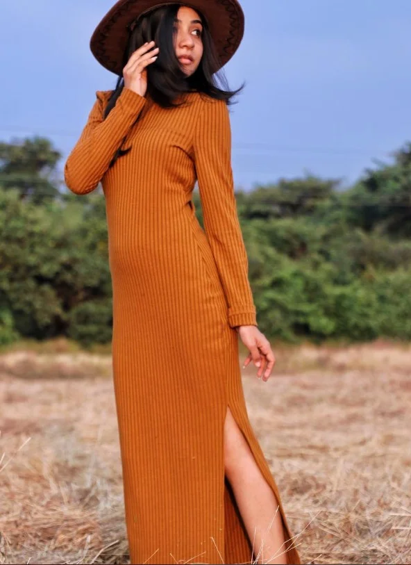 Rust orange outfit with neutral accessories for warm skin tones.