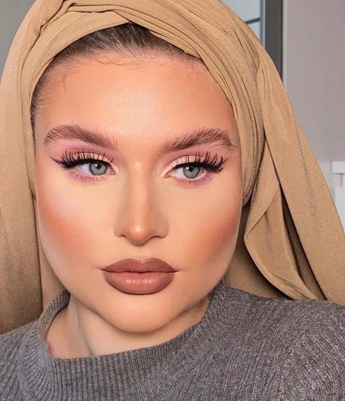 Soft mocha nude lipstick with chic minimalist beauty style.