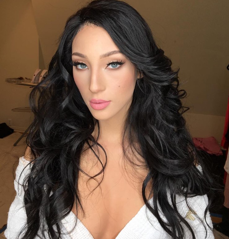 Soft pink lipstick on fair skin with a natural everyday makeup look.