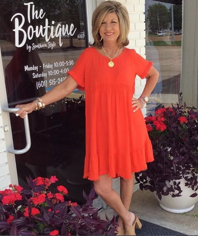 Tomato red dress styled for women with warm skin tone.