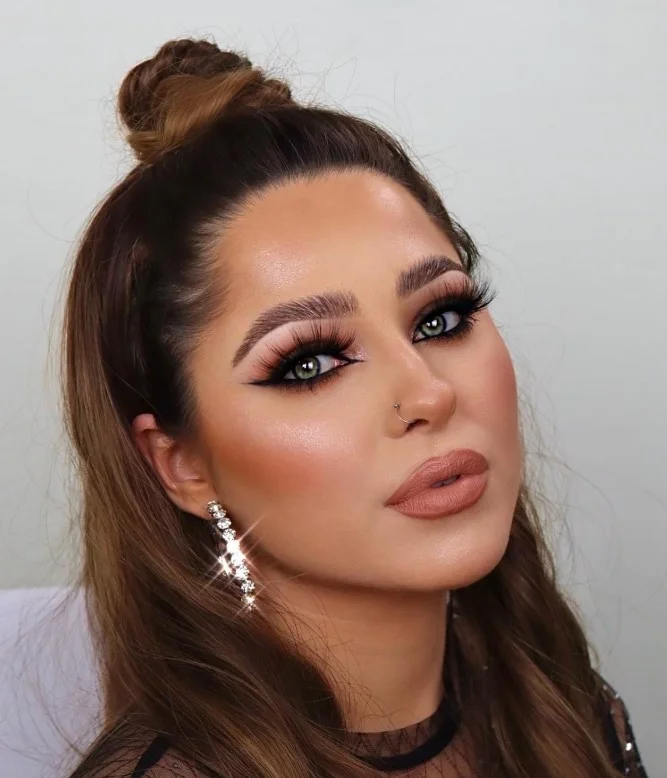 Warm caramel nude lipstick paired with glowing natural makeup.