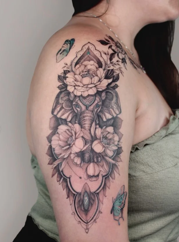 Birth flower upper arm tattoo representing a meaningful birth month
